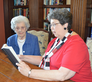 Parkway Place resident Barbara McNeir, right, reads aloud to fellow resident Betty Bryant. Parkway Place resident Barbara McNeir, right, reads aloud to fellow resident Betty Bryant.