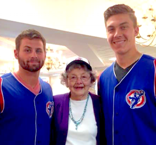 Craig Brooks, left, and Carson Sands of the South Bend Cubs flank a St. Paul's resident. Craig Brooks, left, and Carson Sands of the South Bend Cubs flank a St. Paul's resident.