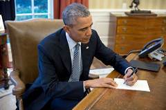 President Barack Obama signs a letter in the Oval Office on March 14. (Pete Souza) President Barack Obama signs a letter in the Oval Office on March 14. (Pete Souza)