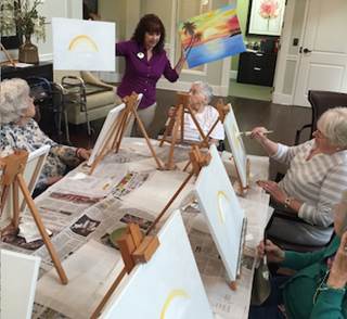 Bonnie Parton leads a painting class for residents at Dominion Senior Living of Johnson City. Bonnie Parton leads a painting class for residents at Dominion Senior Living of Johnson City.
