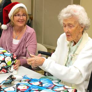 Pat Williams, Angel Tree program coordinator for Crittenton Services, left, and Morningside resident Eunice Tuthill wrap gifts for Crittenton kids at the retirement community’s recent “wrap party.” Pat Williams, Angel Tree program coordinator for Crittenton Services, left, and Morningside resident Eunice Tuthill wrap gifts for Crittenton kids at the retirement community’s recent “wrap party.”