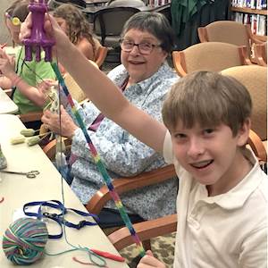 Residents of Presbyterian Village North recently taught some area children how to knit. Residents of Presbyterian Village North recently taught some area children how to knit.