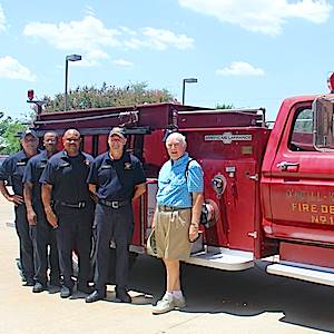 Jim O’Neill, a resident of Highland Springs retirement community, stands in front of his antique fire engine with firefighters from Dallas Station #13. Jim O’Neill, a resident of Highland Springs retirement community, stands in front of his antique fire engine with firefighters from Dallas Station #13.