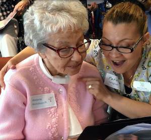 Summer House resident and Joyful Hearts choir member Marjorie Nicholson practices with Villa Gardens caregiver Maria Para. Summer House resident and Joyful Hearts choir member Marjorie Nicholson practices with Villa Gardens caregiver Maria Para.