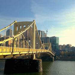 One of Pittsburgh’s nicknames is “The City of Bridges.” Several yellow ones cross rivers in the downtown area. (Photo by Lois Bowers) One of Pittsburgh’s nicknames is “The City of Bridges.” Several yellow ones cross rivers in the downtown area. (Photo by Lois Bowers)